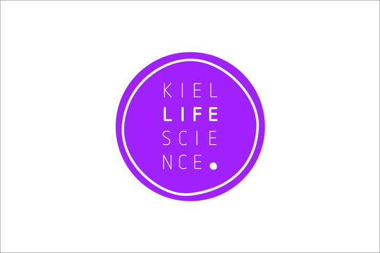 Ein Logo: Ein lilafarbener Kreis mit der Inschrift „Kiel Life Science“.