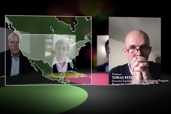 Links im Bild eine Karte von Amerika, rechts daneben das Bild eines Professors, der scheinbar per Videoschalte eingeblendet wird. 